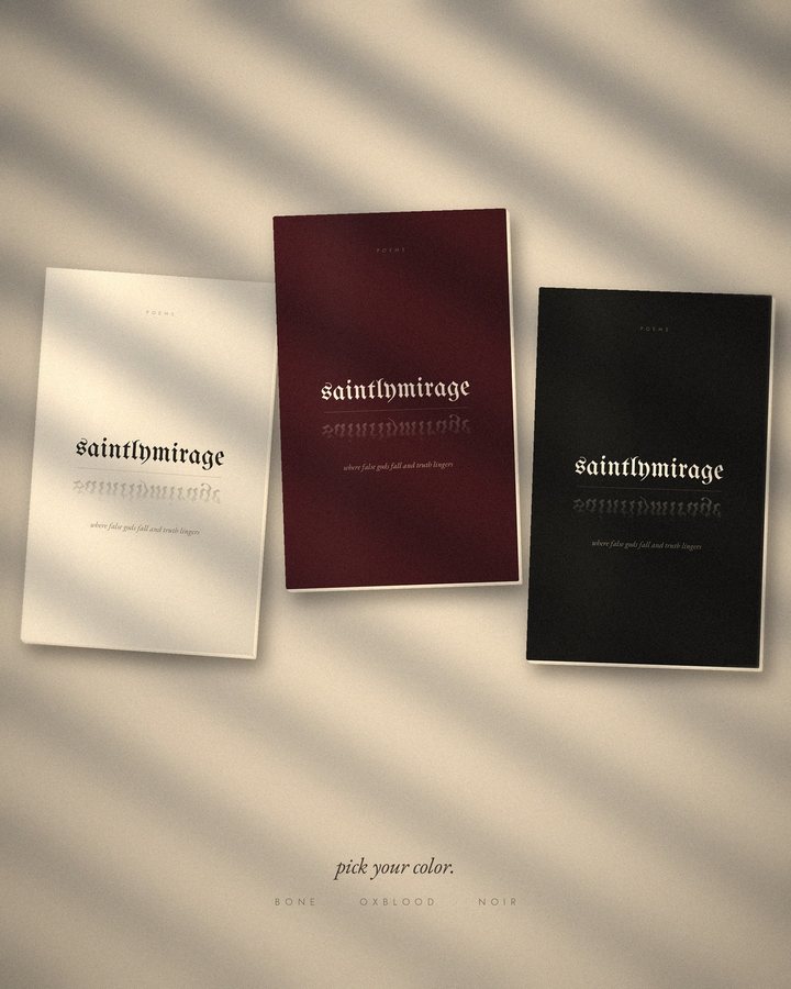The noir, bone and oxblood editions of saintlymirage lying in window light